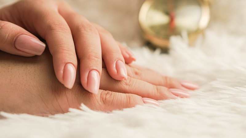 Soft pink hands resting